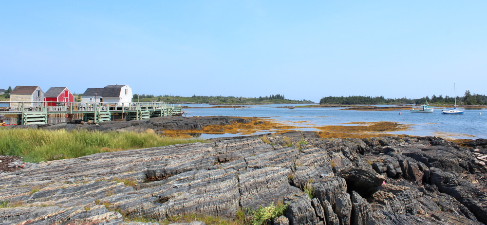 A gorgeous view of the slate rocks near Blue Rocks harbour. This little harbour has a couple of boats and many kayaks ready to tour the area.
