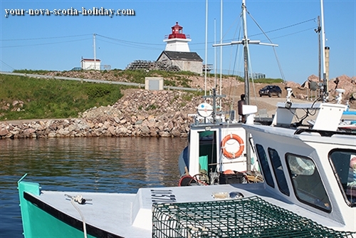 Neil's Harbour in northern Cape Breton.  A delightful fishing village complete with a lighthouse and seafood shack on the cliffs overlooking the Atlantic ocean.