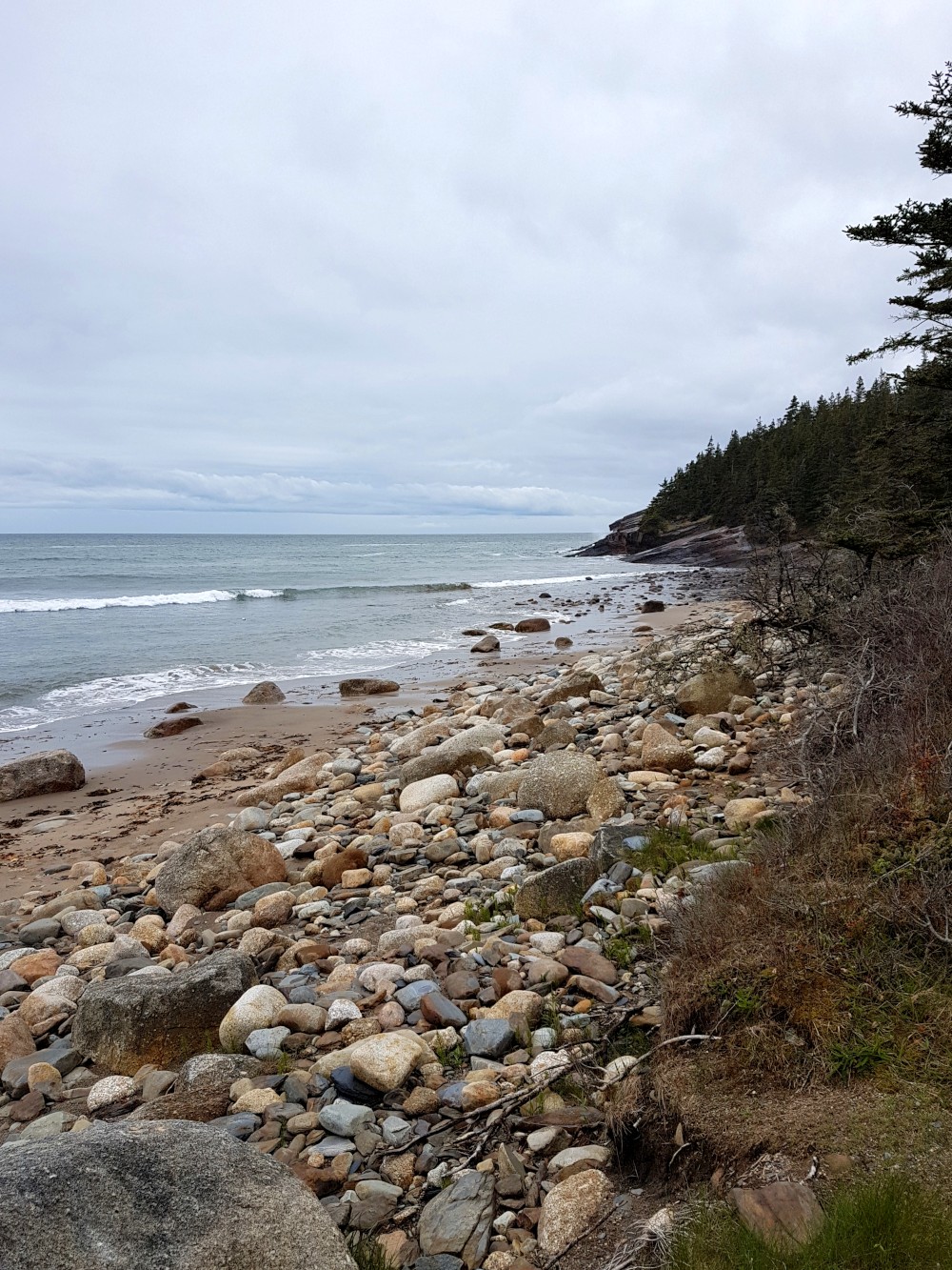 The beaches along Gaff Point display colourful rocks that have shaped and re-sized by the ocean.