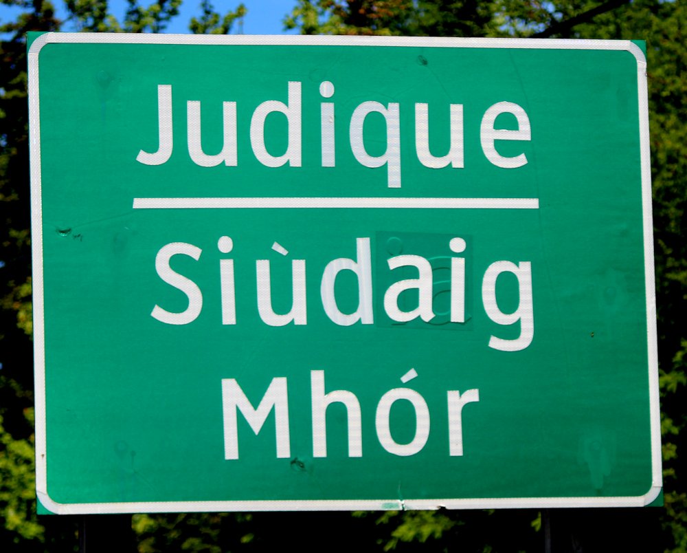 This is Judique along the Ceilidh Trail on the west coast of Cape Breton.  All community names are in English & Gaelic along the Ceilidh Trail.